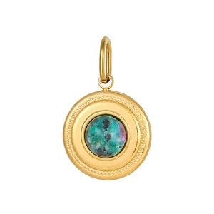 Macro detail of round gold pendant with green natural stone and braided frame