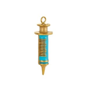 Detailed close-up of a vintage gold syringe charm with blue enamel inlay and scale marks