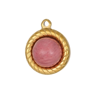 Detail of round gold twisted bezel pendant with pink stone inlay for jewelry making