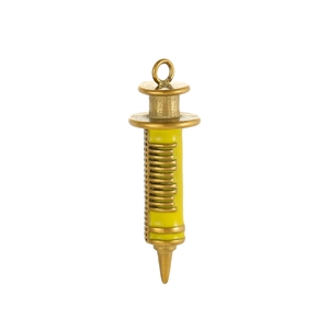 Macro detail of bronze syringe pendant with yellow enamel oil dripping and scale lines