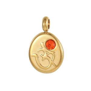 Detailed close-up of gold stainless steel Om pendant with an orange zircon stone inlay