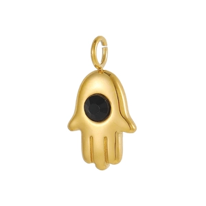 Macro shot of gold plated Hamsa Hand charm with a black faceted stone detail