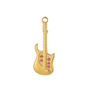 Macro shot of gold guitar pendant with pink zircons and polished metal finish