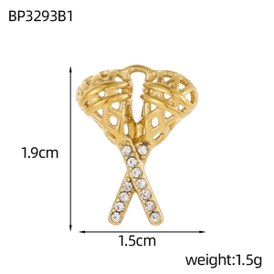 Macro view of a gold-plated stainless steel guitar pick pendant with sparkling zircons
