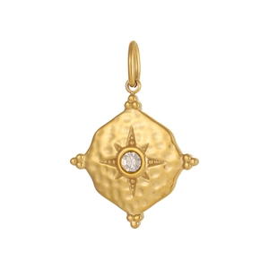 Detailed macro view of gold-plated oval pendant featuring hand-hammered texture and zircon star