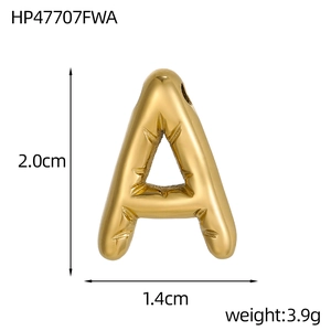 Macro shot of gold 14k bubble letter A pendant with starburst detail showing 2.0cm height