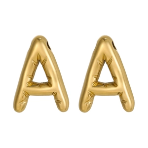 Detailed macro view of 3D puffy gold letter A earrings with textured metal engraving