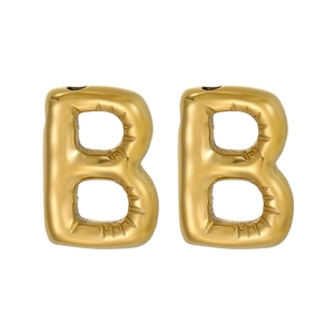 Macro detail of bubble-style gold letter B pendant with realistic 3D inflated stitch texture