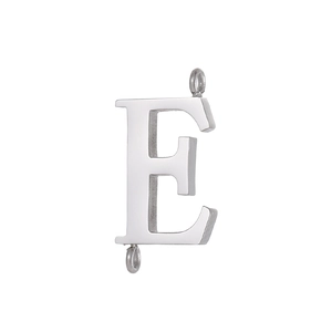 Detailed macro view of polished stainless steel letter E pendant with dual DIY connector rings