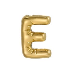 Macro shot of 14k gold plated 3D bubble letter E pendant with detailed engravings