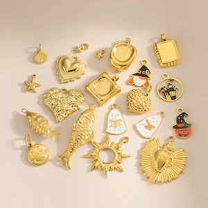 Gold plated stainless steel charms featuring sea motifs, hearts, and Halloween enamel drips