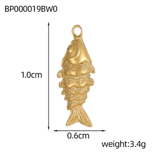 Detailed view of a gold fish pendant with engraved scales measuring 1.0cm by 0.6cm