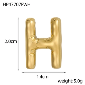 Detail view of 14k gold bubble H letter pendant with bamboo texture and 2.0cm height