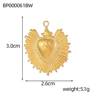 Detail view of sacred heart pendant with dimensions 3.0cm by 2.6cm and 5.1g weight