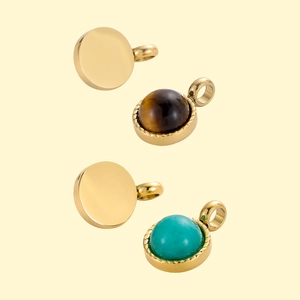Detail of vintage sunburst round pendants with turquoise and tiger eye stone inlay