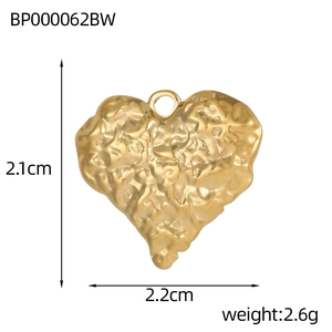 Golden heart-shaped pendant with hammered texture and dimensions 2.1cm by 2.2cm