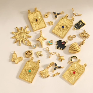 Baroque style gold stainless steel charms featuring evil eye, sun, and tarot card designs