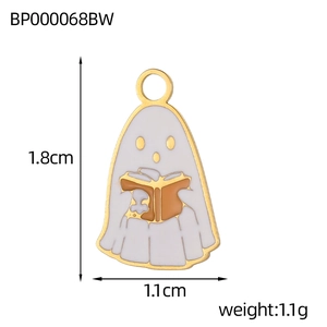Macro shot of Halloween ghost pendant with gold edges and dimensions 1.8cm by 1.1cm