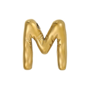 Close-up of golden letter M bubble pendant with bamboo texture and threading hole