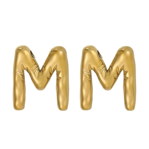 Detailed close-up of shiny gold 3D puffy alphabet M charms with textured metallic surface