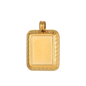 Macro detail of a vintage golden irregular geometric pendant with grooved texture