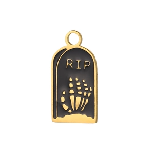 Detailed view of a gold-tone RIP tombstone charm with a skeleton hand design for DIY jewelry