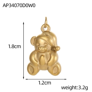 Detailed view of a gold bear pendant with Christmas hat, size 1.8cm by 1.2cm, weight 3.2g