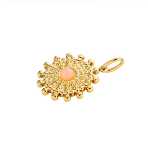 Detail of a vintage golden sunflower pendant with a pink stone inlay on a white background