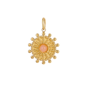 Detail of vintage gold sunflower pendant with pink stone inlay and sunburst design