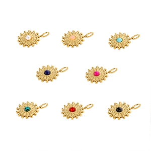 Macro view of vintage stainless steel sunflower pendants with colorful natural stone inlays
