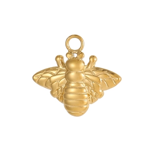 Detailed close-up of a polished gold bee-shaped metal pendant with intricate wing textures
