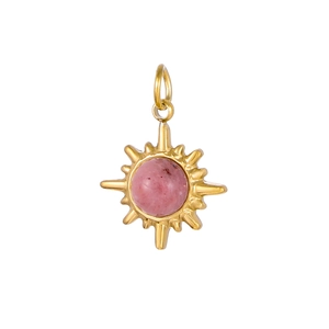 Detail of vintage sunburst stainless steel pendant with pink stone and gold finish
