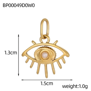 Detailed view of a gold Evil Eye pendant measuring 1.3cm x 1.5cm with a white bead inlay