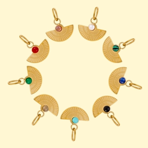 Macro detail of fan-shaped pendants with radial texture and various inset natural stones