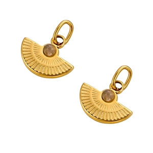 Detail of fan-shaped gold pendants with radiant textures and natural stone inlays