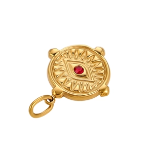 Detailed macro view of vintage evil eye circular pendant with red zircon inlay