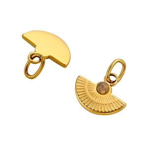 Detailed view of fan-shaped golden pendant with sunburst texture and grey gemstone
