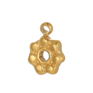 Close-up of golden stainless steel flower pendant charm for DIY jewelry making