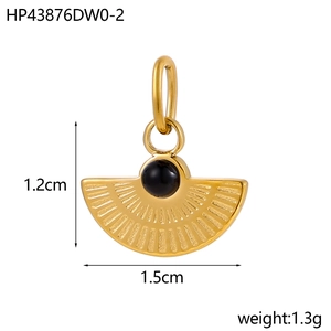 Detail view of 1.5cm wide gold fan pendant with black stone and measurement markings