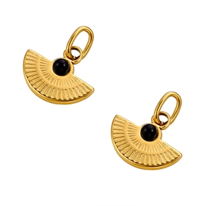 Detailed view of vintage gold fan-shaped pendants with black round stone inlay