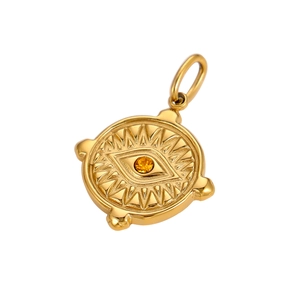 Detailed view of a gold evil eye charm with amber gemstone and radiating relief texture