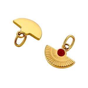 Detail view of gold fan-shaped pendants with red stone inlay and polished back finish
