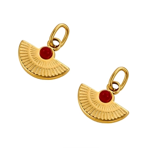 Close-up of fan-shaped golden pendants with radial patterns and red natural stones