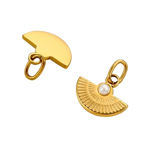 Detailed view of golden fan-shaped pendants with white pearls and radial texture