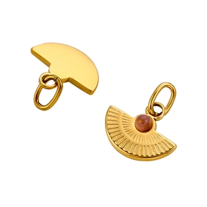 Detailed close-up of golden fan-shaped pendants with natural stone inlay and polished metal back