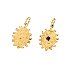 Macro detail of vintage gold oval pendant featuring blue stone evil eye and hammered metal