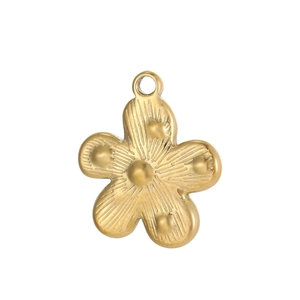 Close-up of golden five-petal flower pendant with sunburst texture and beaded metal details