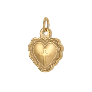 Detail of a golden heart pendant with embossed cross and delicate lace edge texture
