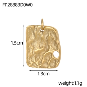Detailed macro view of gold geometric pendant with lava texture measuring 1.5cm by 1.3cm