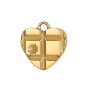 Macro shot of gold heart pendant with unique geometric chocolate grid texture details